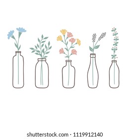 Set of bottles with cute pastel wild flowers and grasses