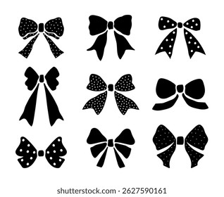 Set of bow silhouettes. Black polka dot bows on a white background. Vector.