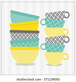 A set of bowls and cups with different patterns