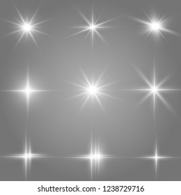 Set of bright beautiful stars. Light effect Bright Star. Beautiful light for illustration. Christmas star. Vector sparkles on transparent background.White glowing light