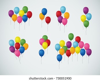 A set of bright and colorful balloons on a black string
