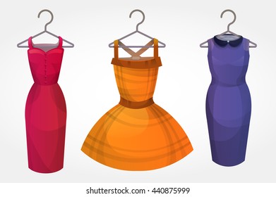 Set of bright dresses on hangers