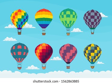 Set of brightly colored hot air balloons in the sky with clouds.Vector icon design.