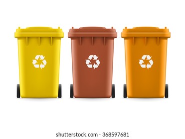 Set of brown yellow and orange buckets for trash with sign arrow