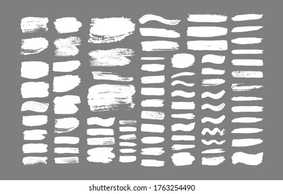 Set von Pinselstrichen. Grunge Designelemente. Goldene Farbe, Tinte, Pinsel, Linien, grungy. Schmutzige künstlerische Kisten, Rahmen. Goldlinien einzeln . Abstrakte goldglänzende, strukturierte Kunstgrafik. Vektorgrafik