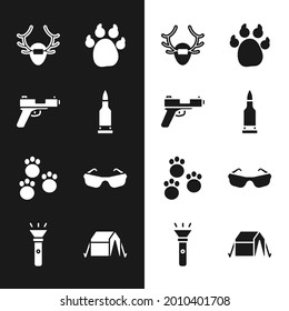 Set Bullet, Pistol or gun, Deer antlers on shield, Paw print, Glasses, Tourist tent and Flashlight icon. Vector