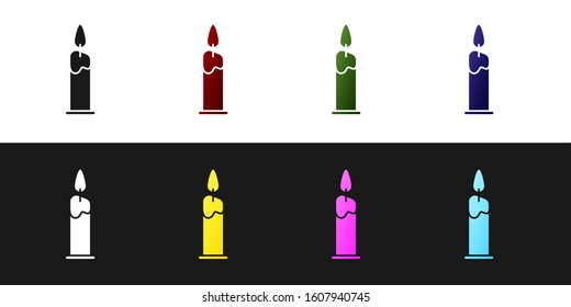 Set Burning candle in candlestick icon isolated on black and white background. Cylindrical candle stick with burning flame.  Vector Illustration