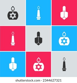 Set Burning candle,  and Hanukkah dreidel icon. Vector