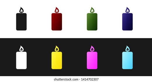 Set Burning candle icon isolated on black and white background. Old fashioned lit candle. Cylindrical aromatic candle stick with burning flame. Vector Illustration