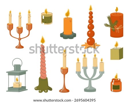 Set of burning candles in decorative holders and jars with various shapes and colors for holiday and cozy interior design themes