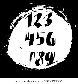 Set of calligraphic ink numbers. Textured brush lettering. Vector illustration.