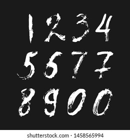 Set of calligraphic numbers painted by white  brush on isolated black background. Lettering for your design. Vector illustration