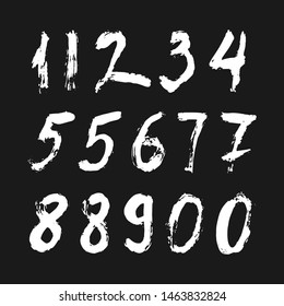 Set of calligraphic numbers painted by white  brush on isolated black background. Lettering for your design. Vector illustration