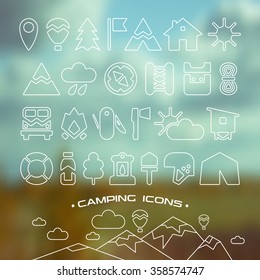 Set of camping and hiking icons in thin line style. White icons on blurred background