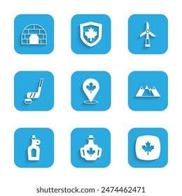 Set Canadian maple leaf, Bottle of syrup, Mountains, Ice hockey stick and puck, Wind turbine and Igloo ice house icon. Vector