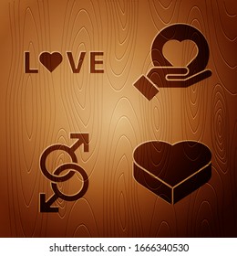 Set Candy in heart shaped box, Love text, Male gender symbol and Heart on hand on wooden background. Vector