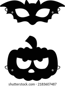 set of carnival masks in the shape of a pumpkin and a bat