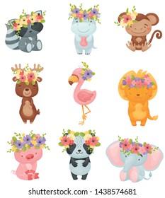 Set of cartoon animals with wreaths of flowers on their heads. Vector illustration on white background.