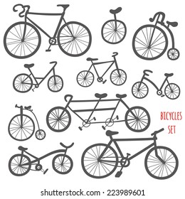 Set of cartoon bicycles. Cute hand drawn bikes black contour