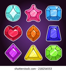 Set of cartoon colorful jewels on the dark background