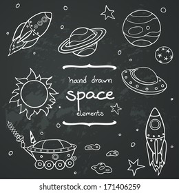 Set of cartoon space elements: rockets, planets and stars. Hand drawn doodle objects on chalkboard background. Childish illustration.