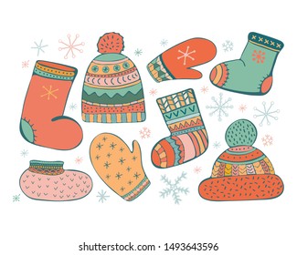 Set of cartoon vector illustration accessories. Icons of winter, warm knitted clothes. Socks, a cap with a pompom, mittens, valenki, shoes. Hand colored hand drawn set. Doodle