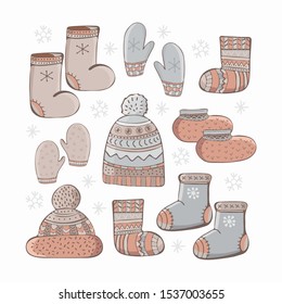 Set of cartoon vector winter accessories. Hand drawing of winter, warm clothes. Socks, a cap with a pompom, mittens, shoes. Fashion graphic. Clothes icons set. Bundle of seasonal clothing.
