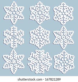 set of carved paper snowflakes