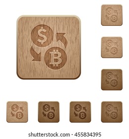 Set of carved wooden Dollar Bitcoin exchange buttons in 8 variations.