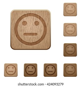 Set of carved wooden Neutral emoticon buttons in 8 variations.