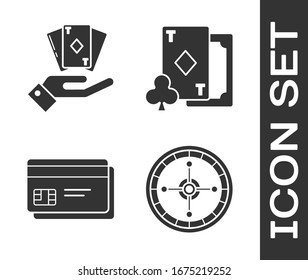 Set Casino roulette wheel, Hand holding deck of playing cards, Credit card and Playing card with diamonds icon. Vector