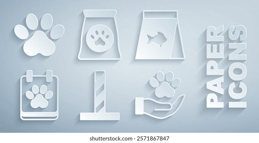 Set Cat scratching post with toy, Food for fish, Calendar grooming, Hands animals footprint, Bag of food pet and Paw icon. Vector