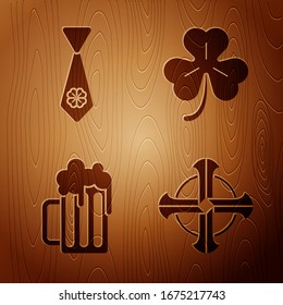 Set Celtic cross, Tie with four leaf clover, Wooden beer mug and Four leaf clover on wooden background. Vector