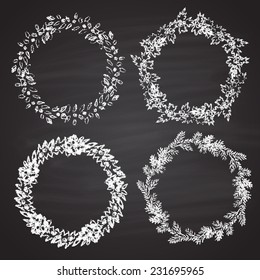Set of chalk painted white Christmas wreaths. Card design. Happy New Year theme.