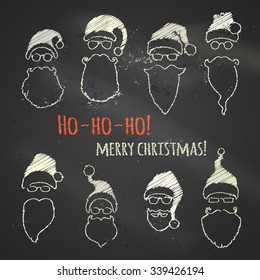 Set of chalk Santa hats and beards. Various Christmas design elements on blackboard background.