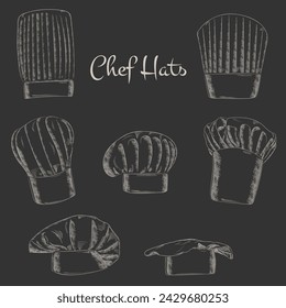 Set of chef caps, hand drawn vector illustration. White chalk on gray board. Vector EPS 10