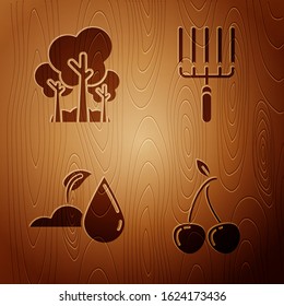 Set Cherry, Trees, Watering sprout and Garden rake in work on wooden background. Vector