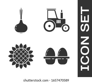Set Chicken egg in box, Onion, Sunflower and Tractor icon. Vector