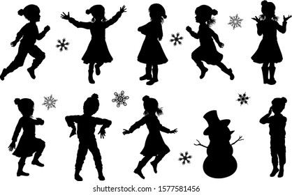 A set of children in silhouette playing having fun in Christmas or winter cold weather clothing