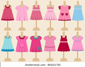 Set of children's dresses for girls on mannequins. Vector illustration.