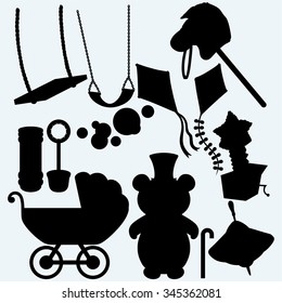 Set of childrens subjects. Kite, toy horse,  jack-in-the-box, swing, soap bubbles and whirligig. Isolated on blue background. Vector silhouettes