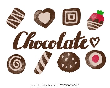 Set of chocolate sweets and chocolate lettering isolated on white