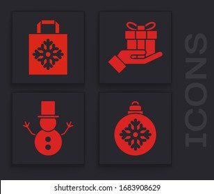 Set Christmas ball, Christmas paper shopping bag, Gift box in hand and Christmas snowman icon. Vector
