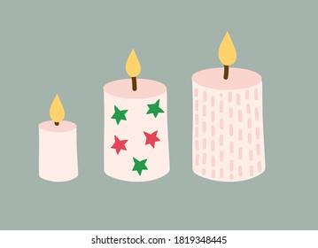 set of Christmas candles. Three beige candles are decorated with red and green stars, stripes and dots. cartoon vector illustration isolated on green background