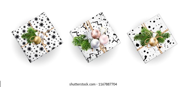 Set of Christmas gift boxes, realistic illustration. Top view. Black and white wrapping paper. Decoration of Christmas toys and Christmas branches. EPS10.