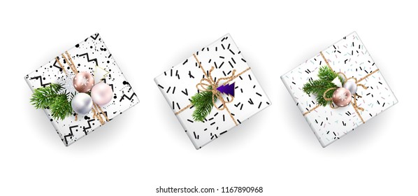 Set of Christmas gift boxes, realistic illustration. Top view. Black and white wrapping paper. Decoration of Christmas toys and Christmas branches. EPS10.