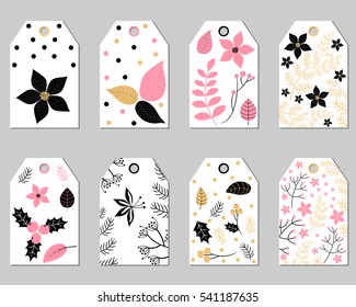 Set of Christmas gift tags with foliage - poinsettia leaves, branches, flowers and berries in pink and black colors