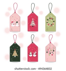 Set of Christmas Gift Tags with snowman, snowflakes, Christmas tree, ball and ornament in pink, green, grey, and white colors with light pink background.