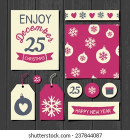 A set of Christmas gift tags, stickers, greeting card template, seamless pattern and washi tape on a gray wooden background.