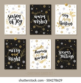 Set Christmas and Happy New Year greeting cards with handwritten brush calligraphy and decorative elements. Decorative vector illustration for winter invitations, cards, posters and flyers.